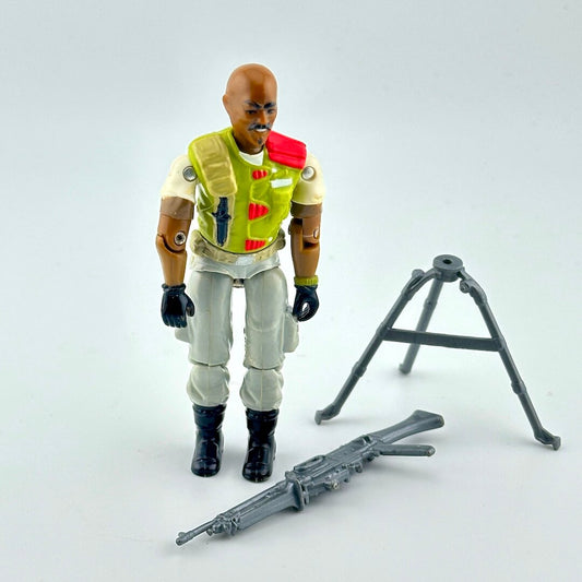GI Joe action figure with accessories against white background. 