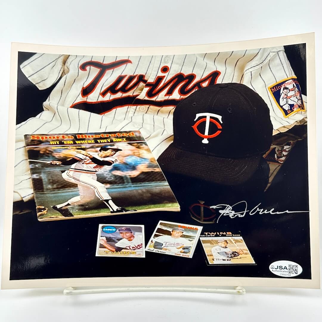 Baseball cap and memorabilia with 'Twins' branding on a photo.