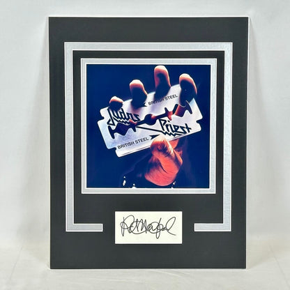 Framed display with a hand holding a 'British Steel' sign and a signature at the bottom.