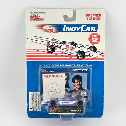 IndyCar model car packaging with card and display stand on a white background