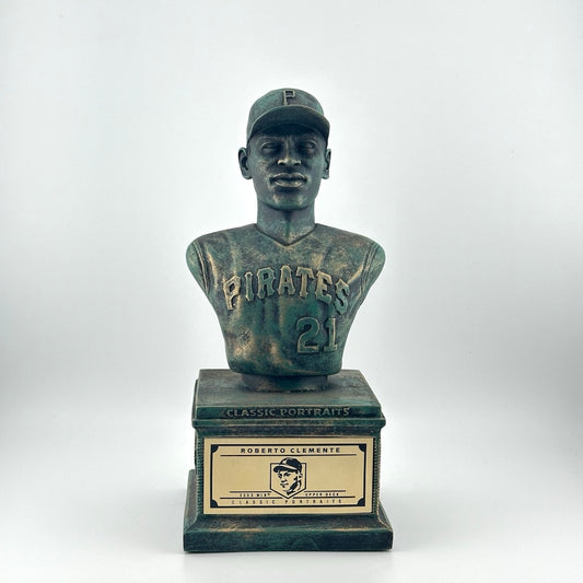 Bronze pedestal with bronze bust of Clemente in Pirates uniform. Gold plaque on pedestal.