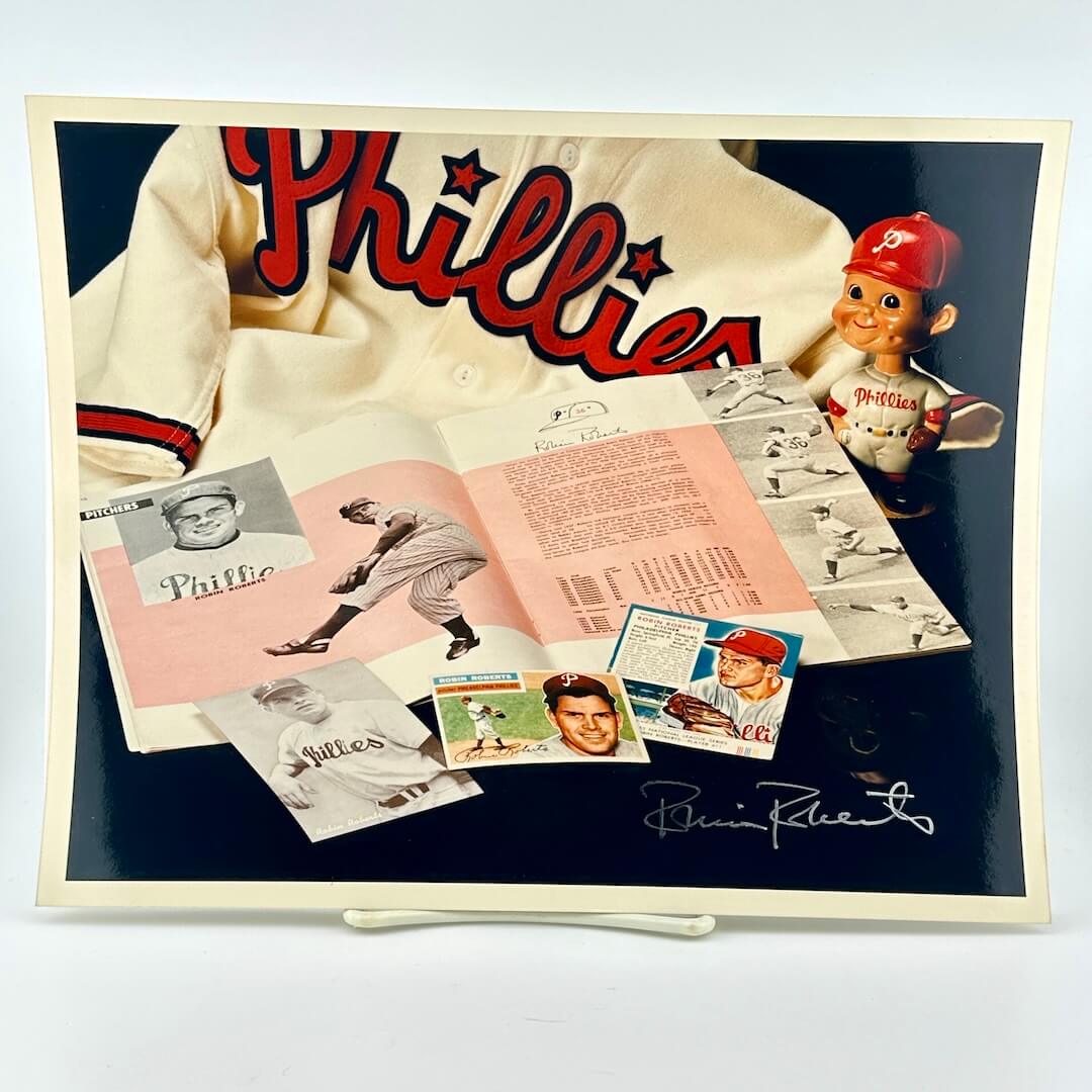 Photo of arranged baseball memorabilia featuring Robin Roberts and his signature.