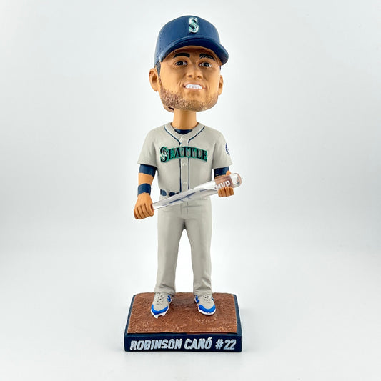 Bobblehead figure of a baseball player in a Seattle uniform with a bat on a white background