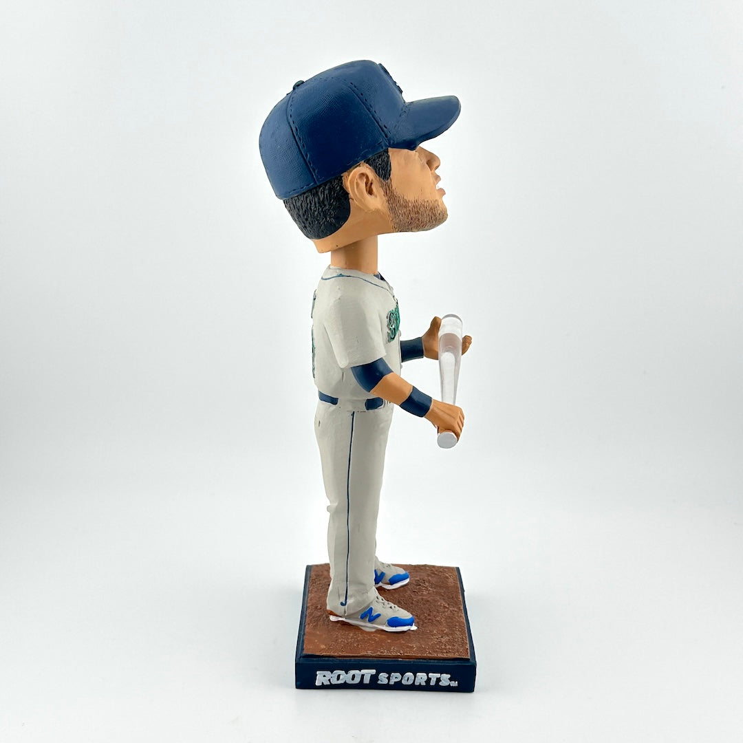 Baseball player bobblehead figure holding a bat on a white background