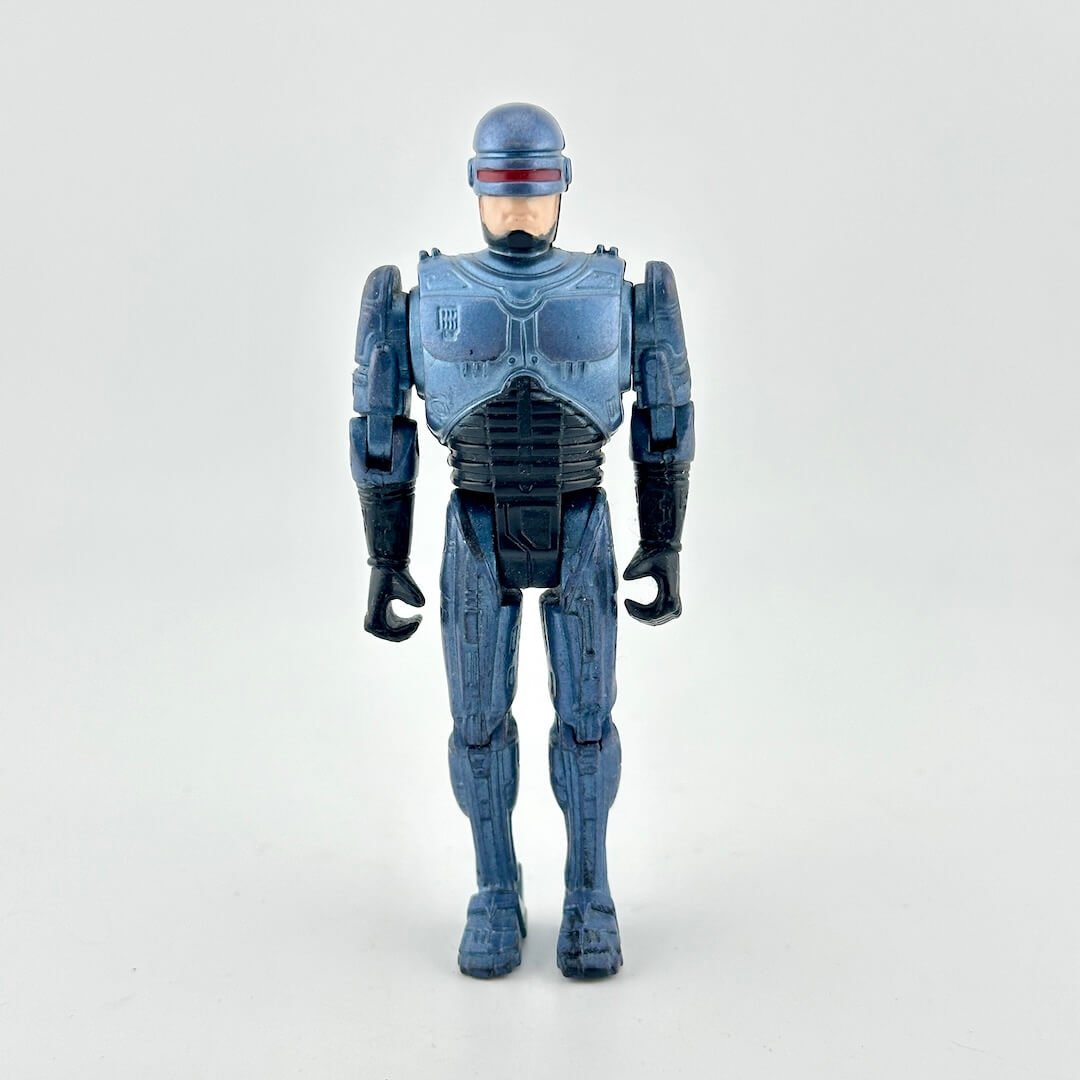 A blue armored action figure standing against a plain light gray background.