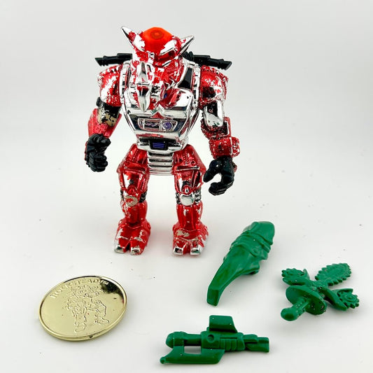 Red and silver robot toy with green parts on a white background