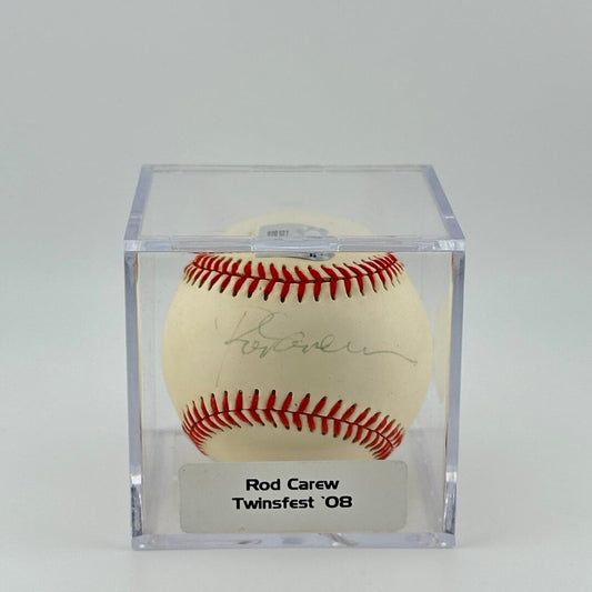 Autographed baseball in plastic cube with sticker label along bottom. 