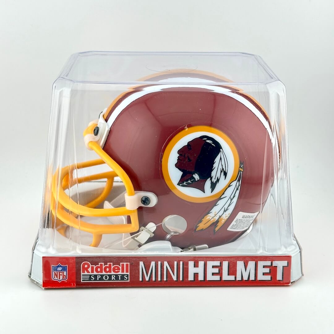 Mini football helmet in packaging with Riddell Sports branding on a white background
