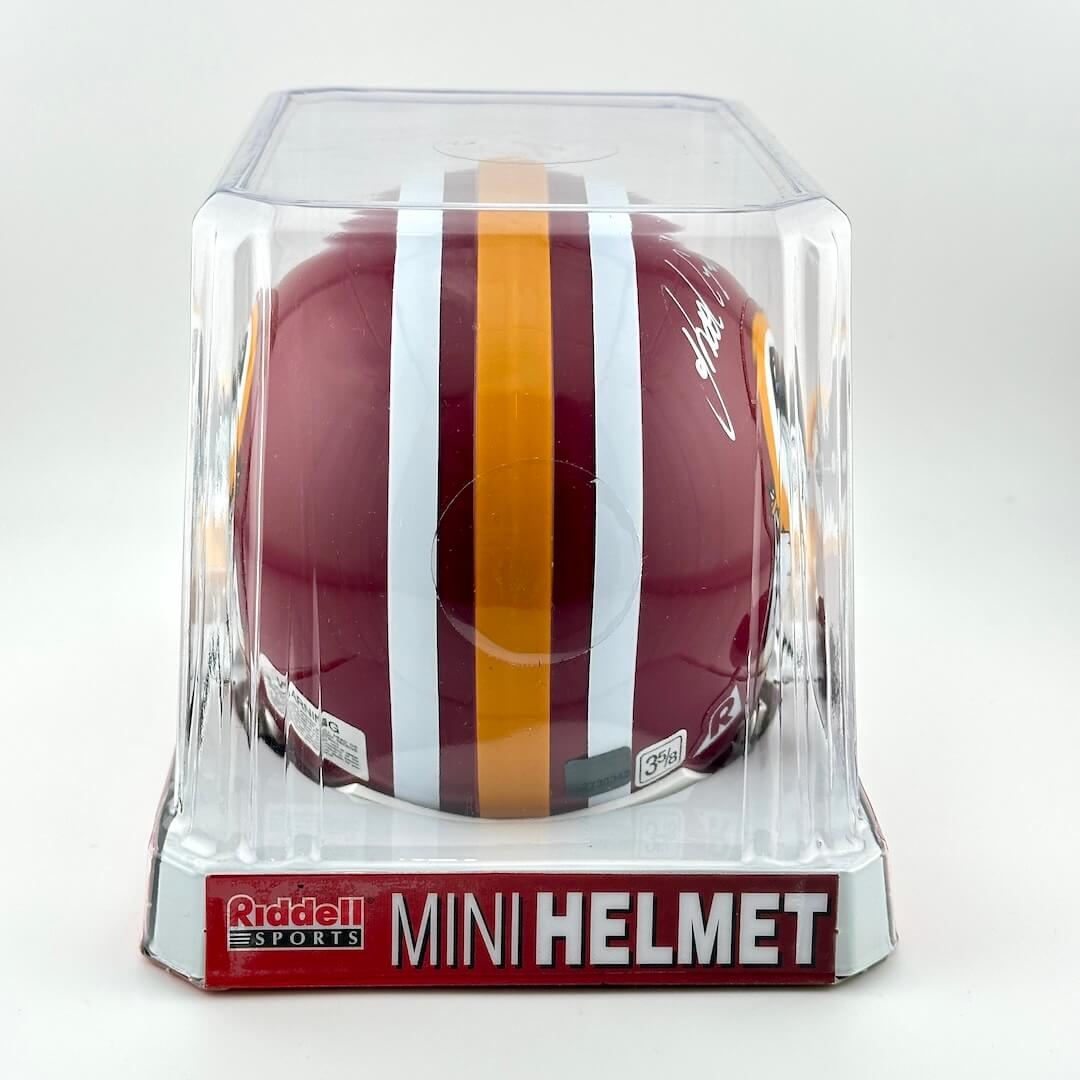Mini football helmet in clear packaging with Riddell Sports branding on a white background