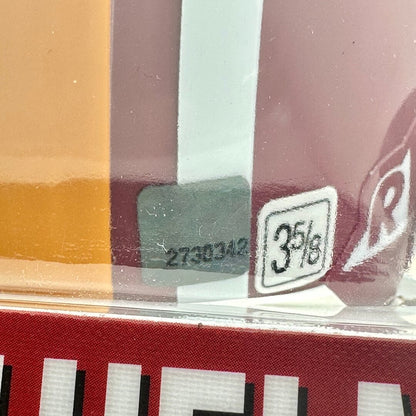 Close-up of a product packaging with a label and barcodes.
