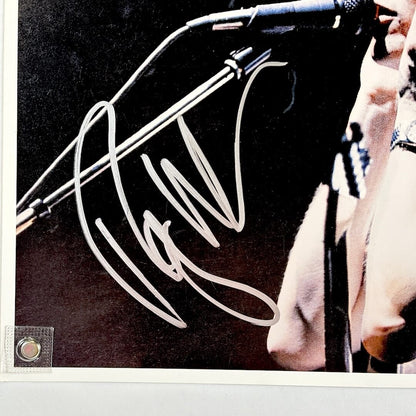 Close up of silver marker signature in bottom left section of photo. 