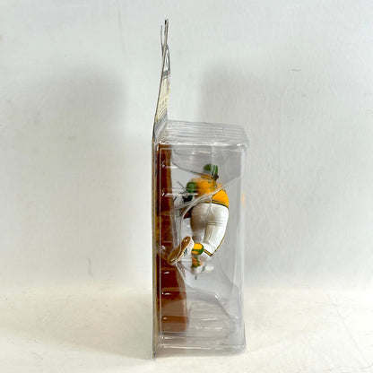 Clear plastic packaging with a small figure inside on a white background