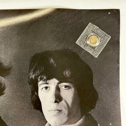 Top right corner of poster with pin hole. 