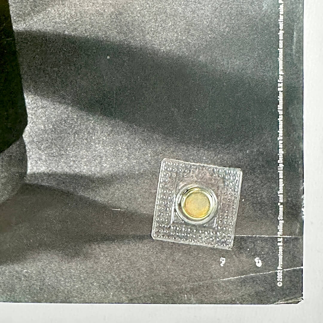 Bottom right corner with copyright information and wear to corner. 