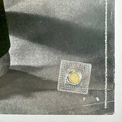 Bottom right corner with copyright information and wear to corner. 