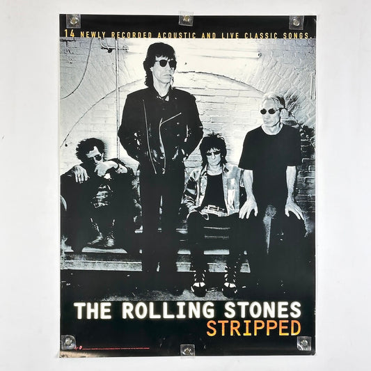Album cover for 'The Rolling Stones Stripped' with band members in black and white.
