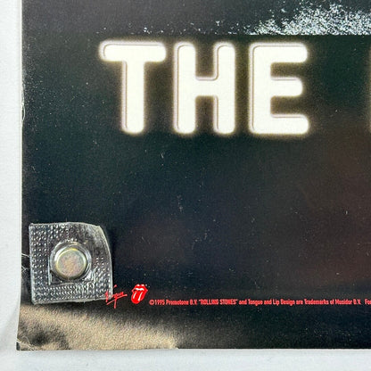 Bottom left corner of poster with crease to tip and copyright information in corner. 