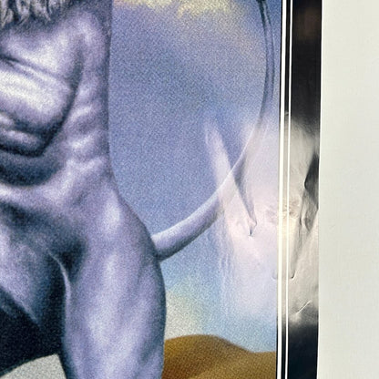 View of poster reflecting light to show dings and creases. 