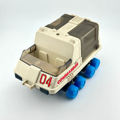 Toy moon rover with blue wheels against white background. 