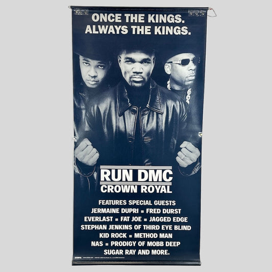 Vinyl posters with three men in black and white with text at top and bottom describing artists on album. 