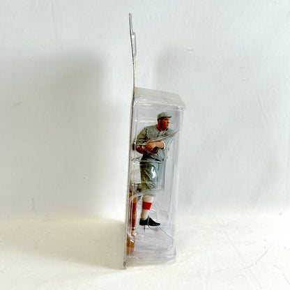 Baseball player figure in a clear plastic packaging on a white background