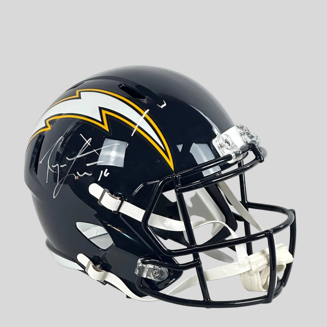 Navy blue football helmet with Chargers logo on side and signature in white nbe