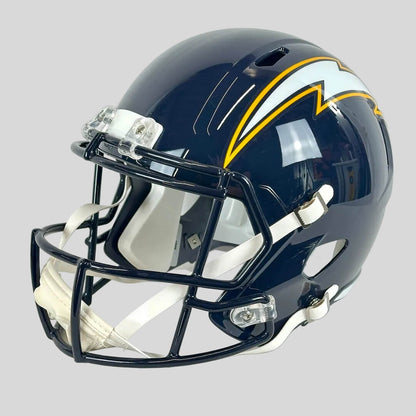 Navy football helmet with yellow accents on a white background