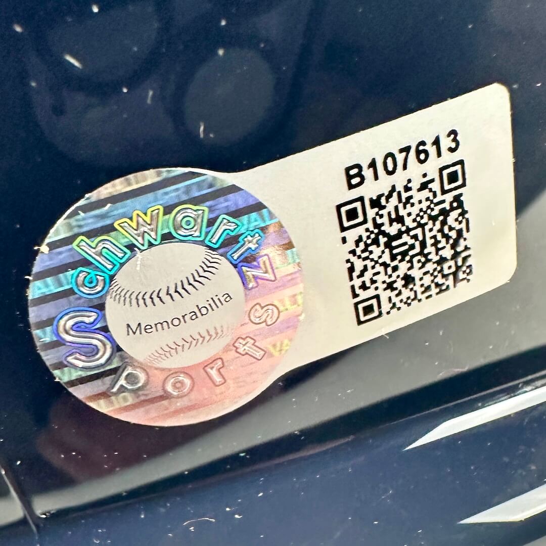 Schwartz Sports memorabilia label with a QR code on a reflective surface