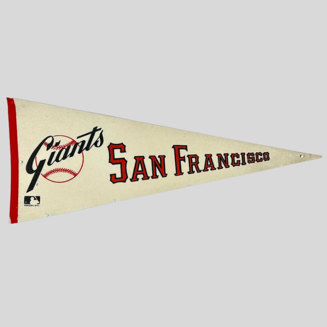 White pennant for the SF Giants with their team name in script, & city name in varsity letter style text. 