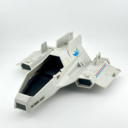 Toy spaceship model on a white background