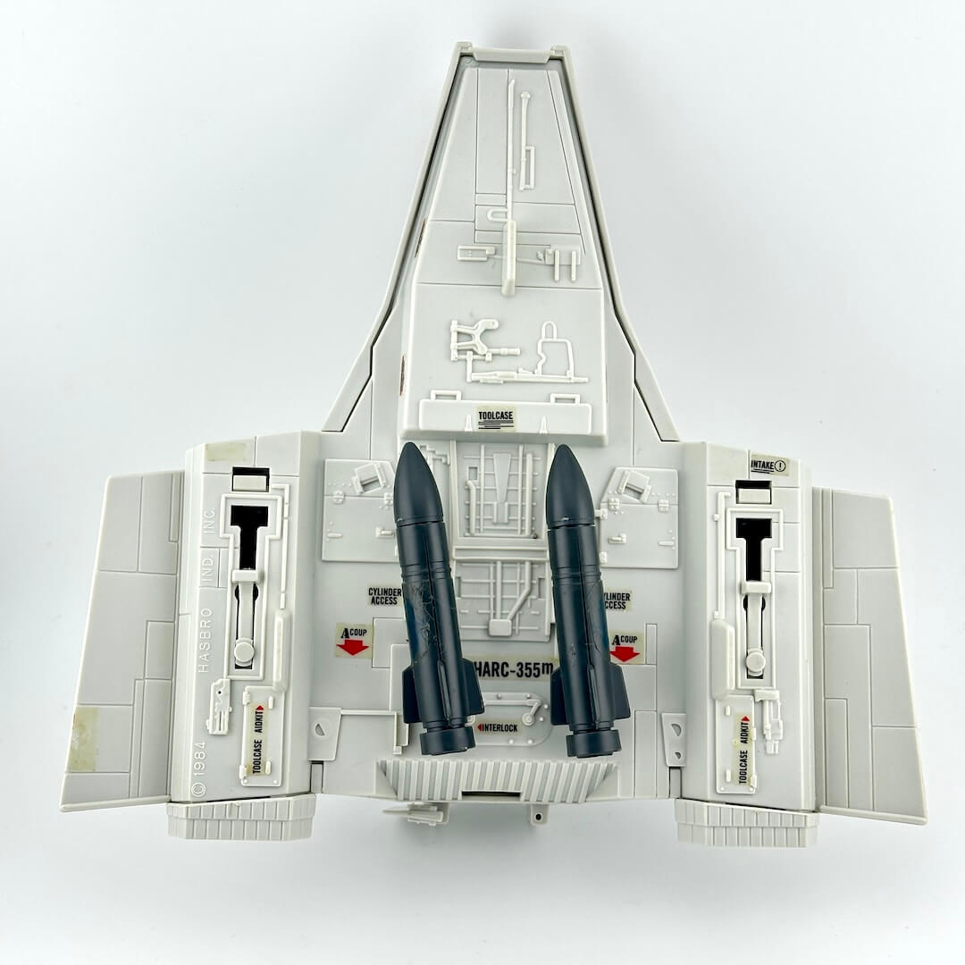 Model of a space shuttle with two rockets on a white background