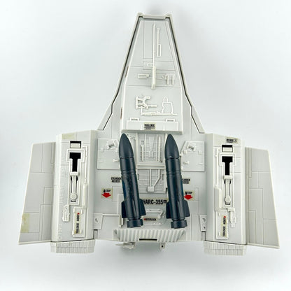 Model of a space shuttle with two rockets on a white background