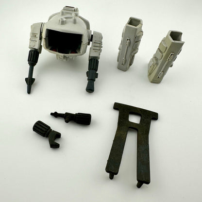 Grey & black plastic parts that assemble into an action figure battle armor for G.I. Joe or Cobra figure. 