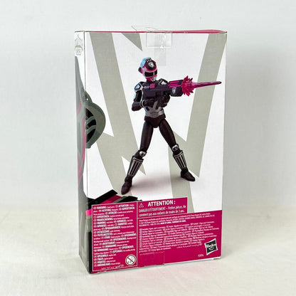 Back of packaging with image of posed action figure above warnings and product information. 