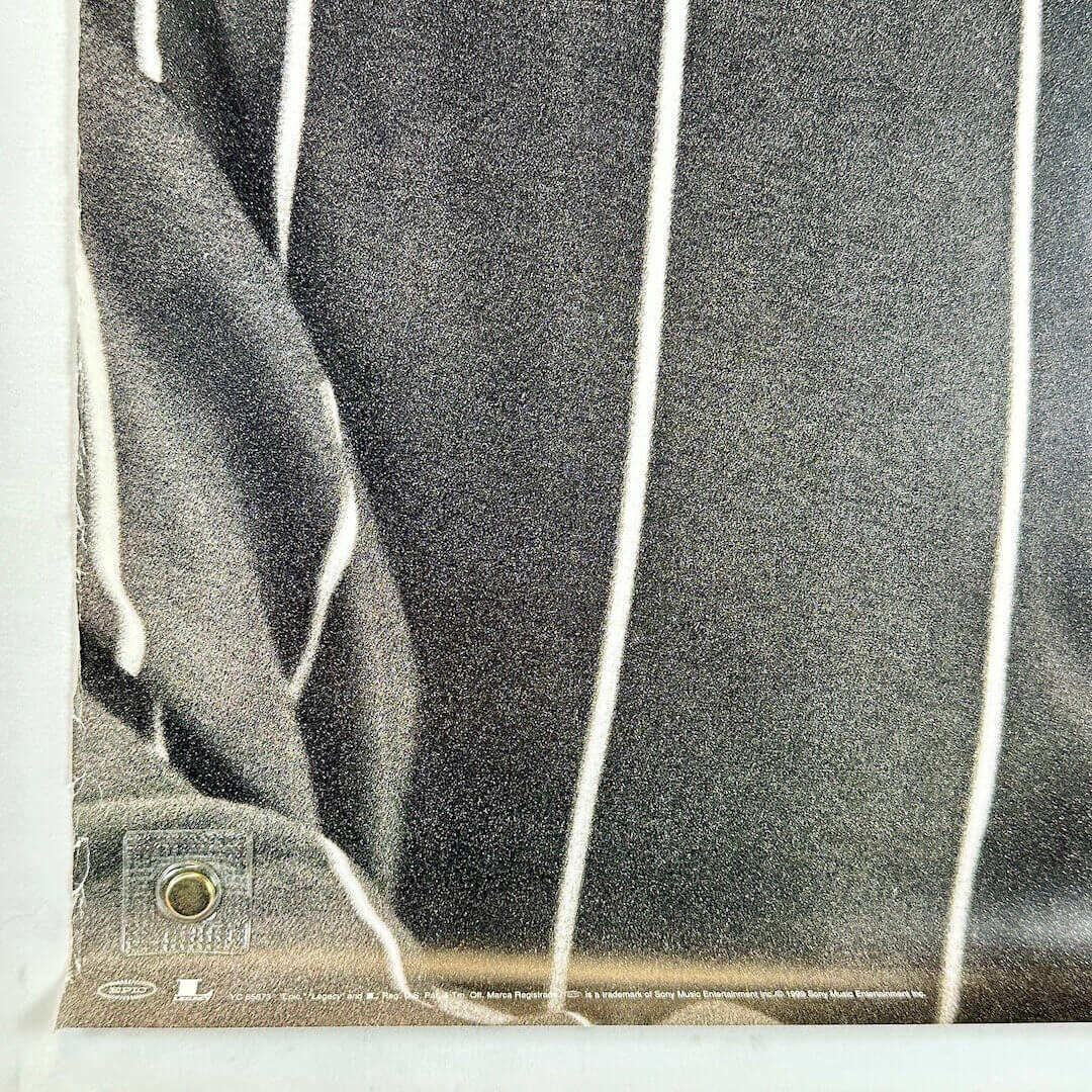 Bottom left corner with wear along left edge. 