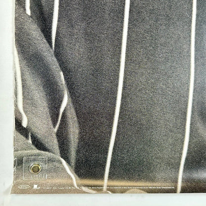 Bottom left corner with wear along left edge. 