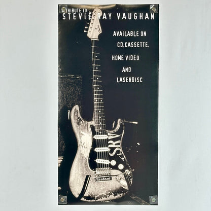 Backside of poster featuring guitar and advertising information. 