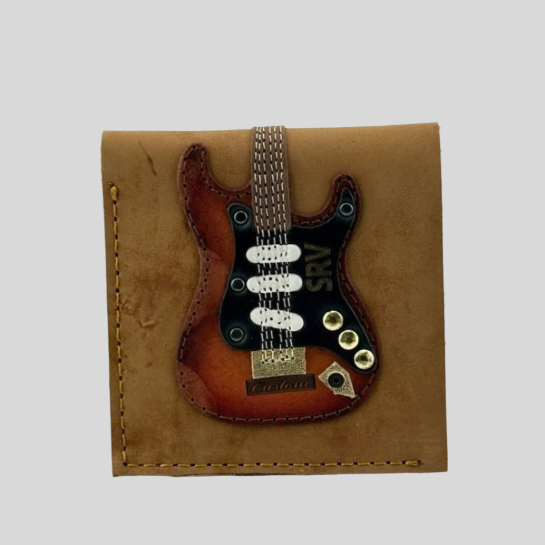 Light brown leather wallet with electric guitar with SRV detail stitched to front.