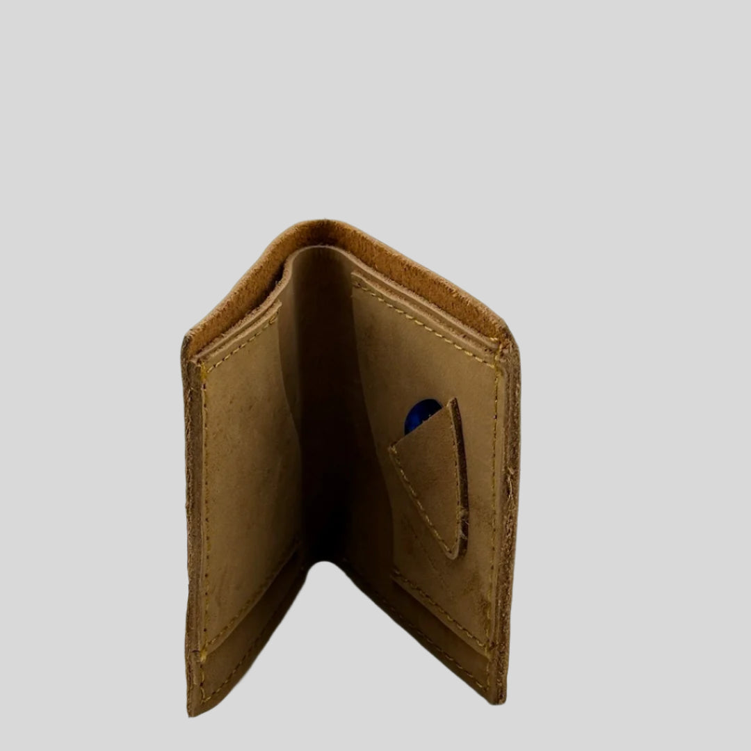 Interior of fawn brown leather wallet with special guitar pick holster with blue pick.