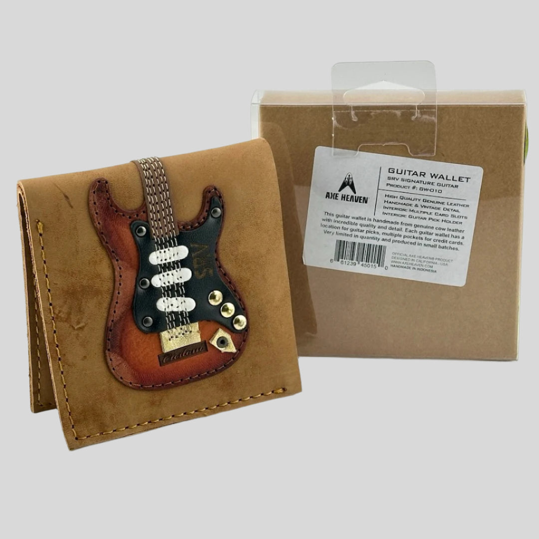 Leather wallet with acoustic guitar stitched on front next to its box that details item information.