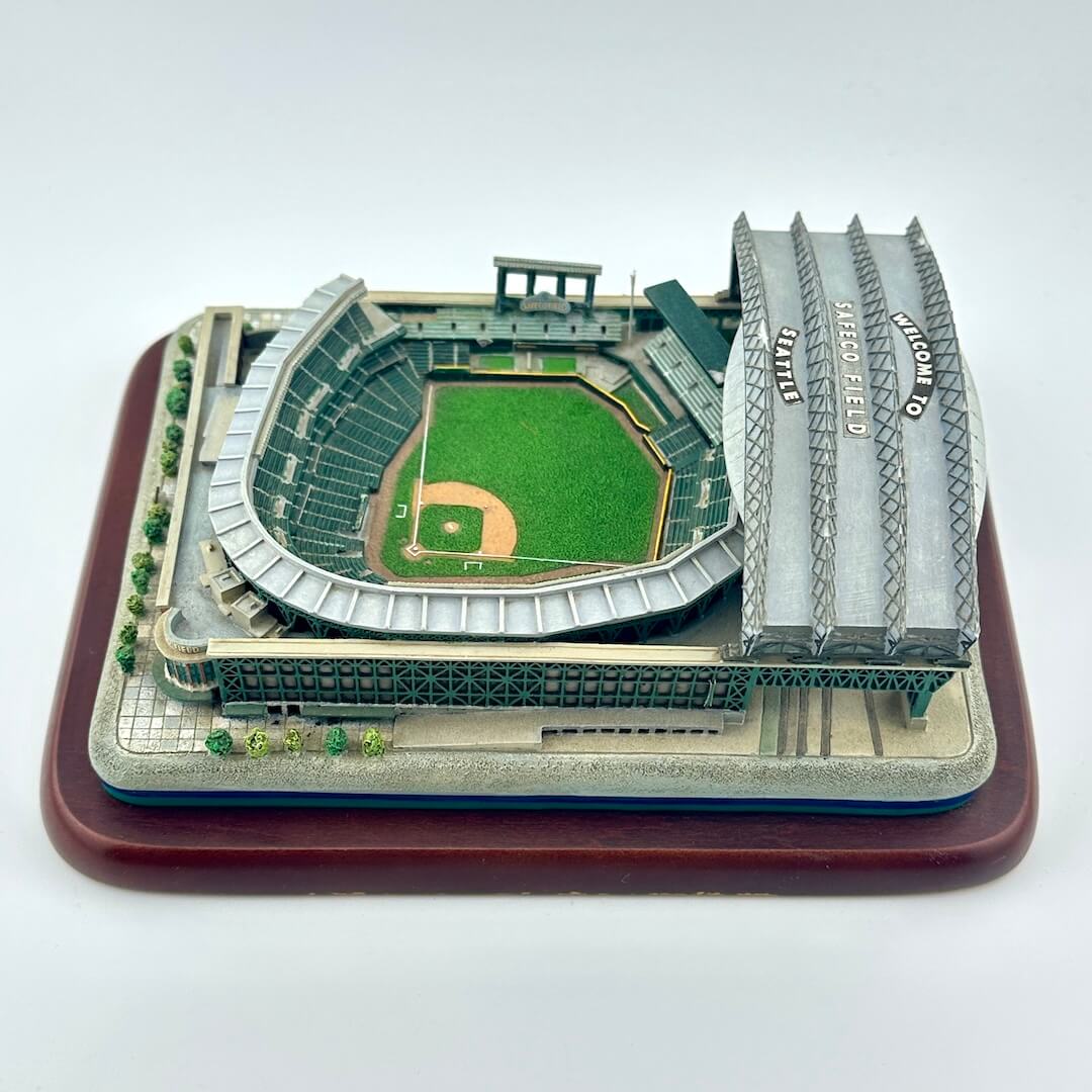 Model of a baseball stadium on a wooden base with a white background