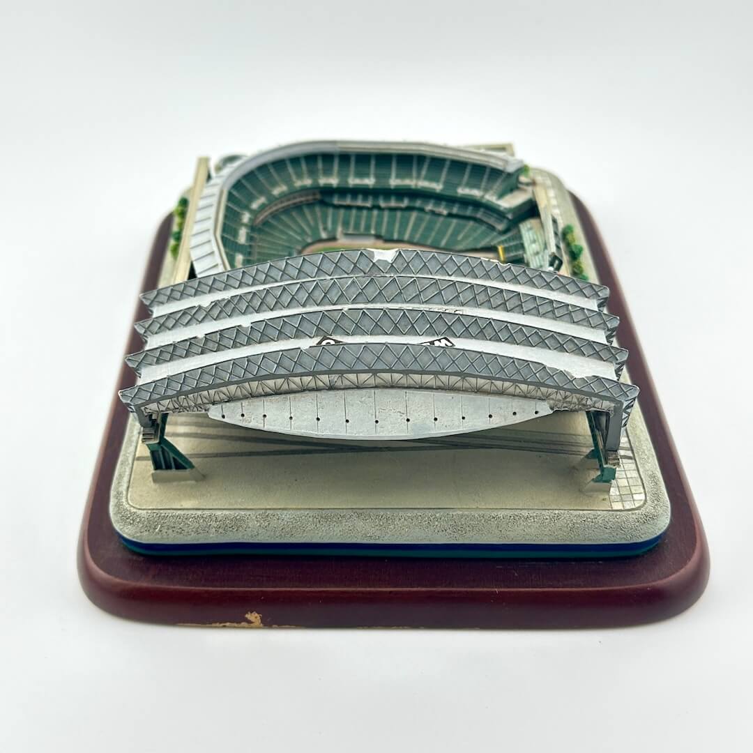 Model of a stadium with seating and track on a white background