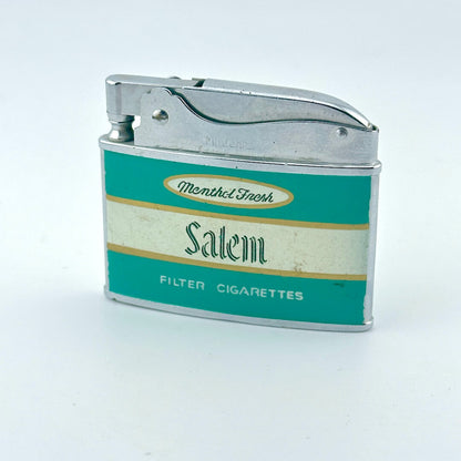 A vintage metal cigarette lighter with a teal and cream Salem filter cigarettes label.