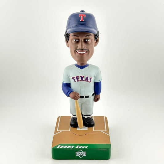 Bobblehead of a baseball player in Texas uniform with a bat on a white background