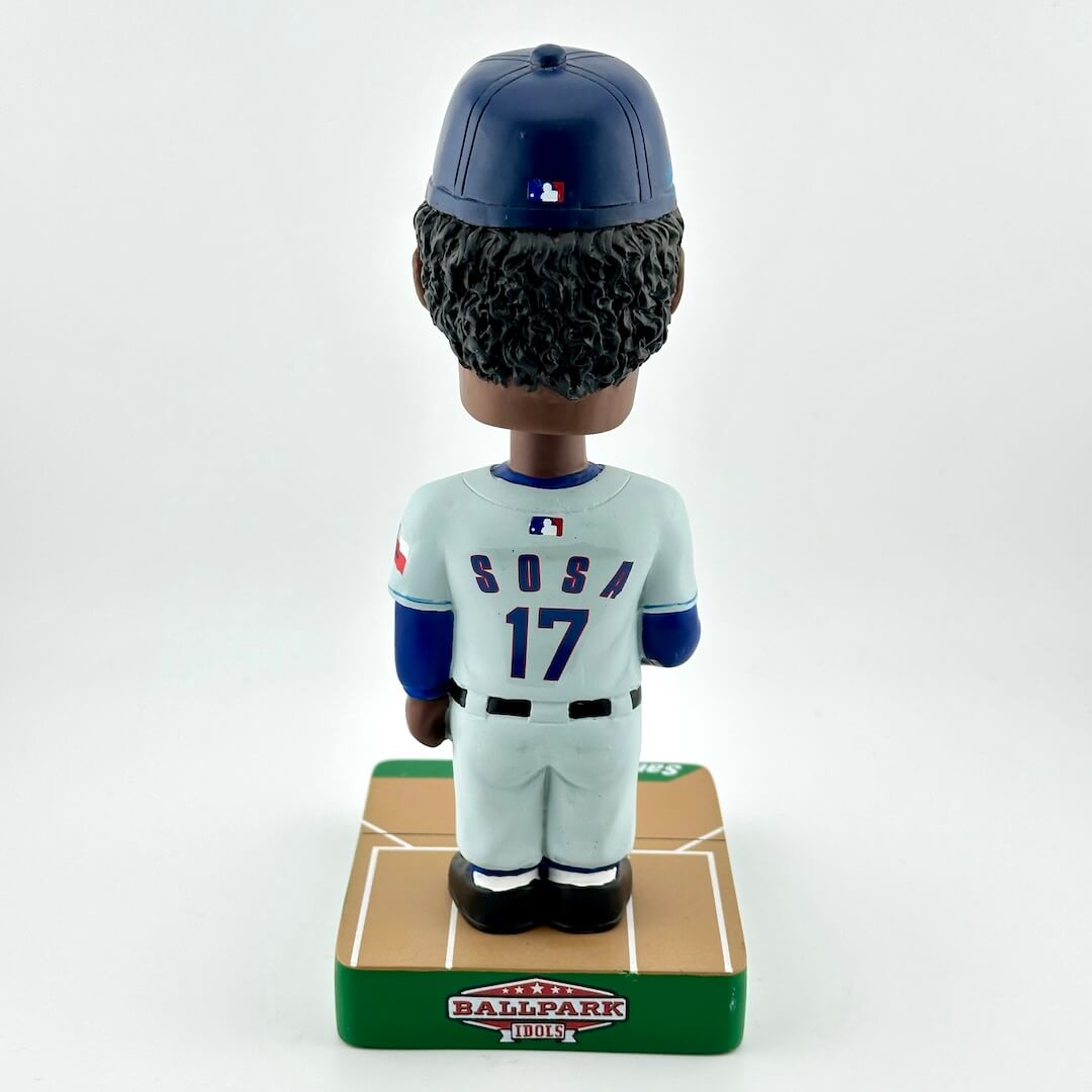 Baseball bobblehead figure with a uniform and helmet on a white background