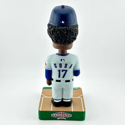 Baseball bobblehead figure with a uniform and helmet on a white background