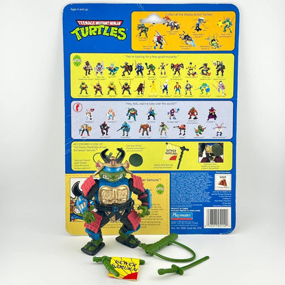 TMNT turtle action figure with accessories and card back on white background. 