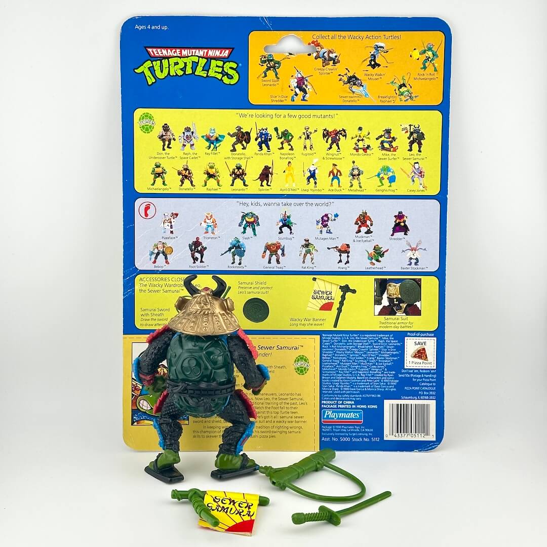TMNT turtle action figure with accessories and card back on white background. 