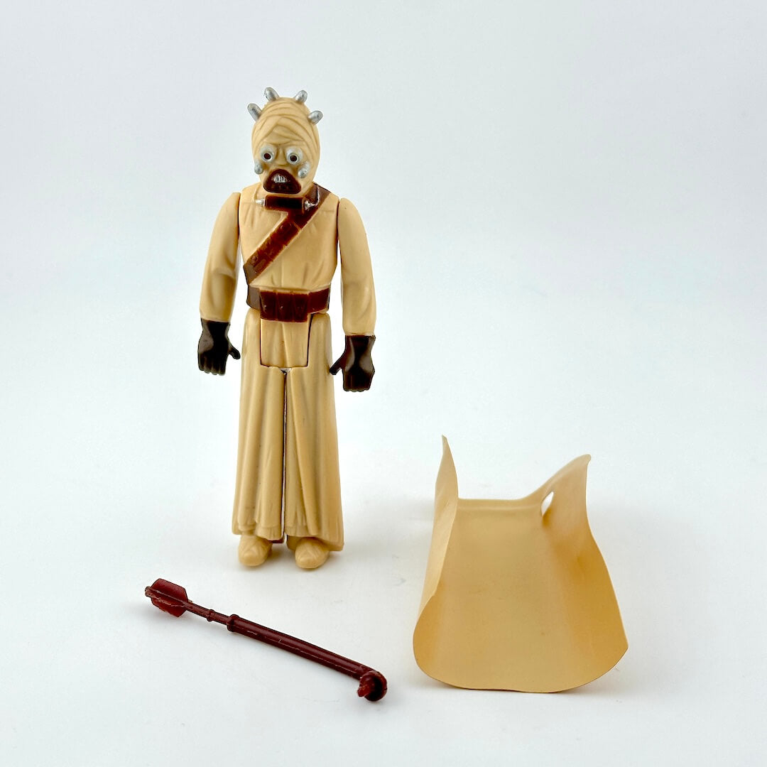 Action figure of a character from a science fiction franchise on a white background