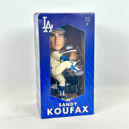 A Sandy Koufax Los Angeles Dodgers bobblehead figure in its original blue window box packaging, with the LA logo.
